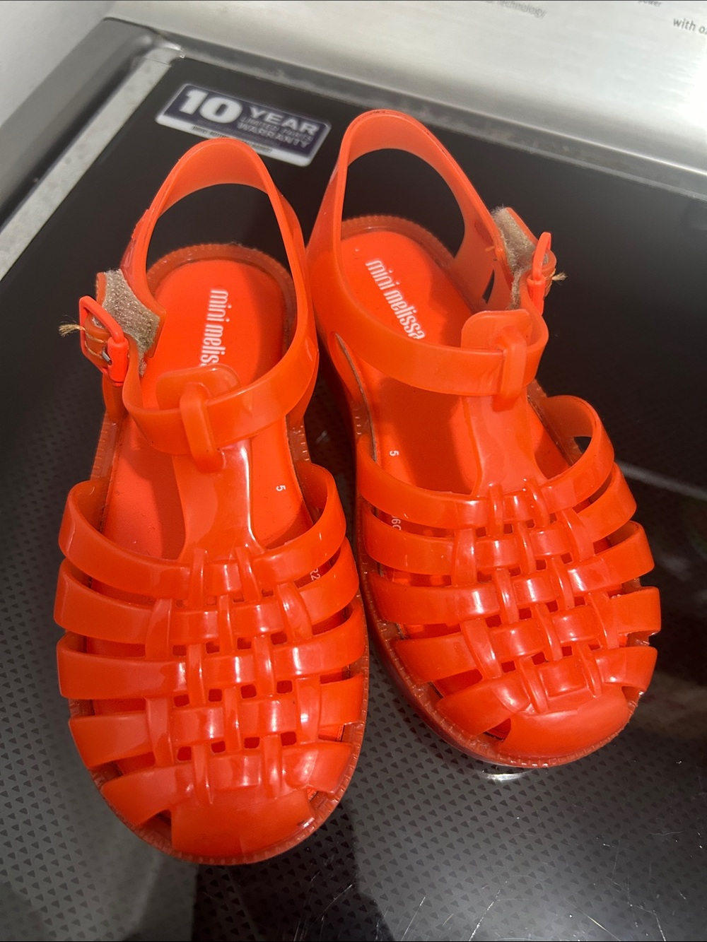 Toddler girls size 10 jelly closed toe sandals Velcro strap orange / red color
